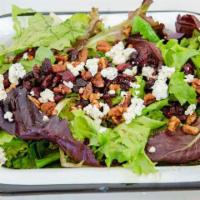 Cranberry Salad · Mixed greens, cranberries, candied pecans, and blue cheese in a balsamic vinaigrette. Add ch...