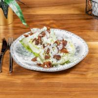 Classic Wedge Salad · Iceberg, bacon, bleu cheese, and red onions with smokey bleu cheese dressing. Gluten-friendl...