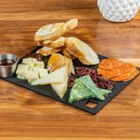 Charcuteries Board · 3 cheeses selected daily, fruit, nuts, local honey, yuzu jam and prosciutto. Smail serves 2 ...