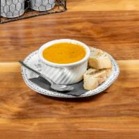 Tomato Basil Soup · Smooth soup with pureed tomatoes and basil.