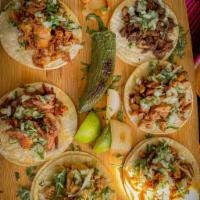 Tacos · Meat choice, cilantro, onions.