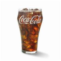 Coke®  · Make sure every bite gets a big sip of deliciousness when you order a large fountain drink.