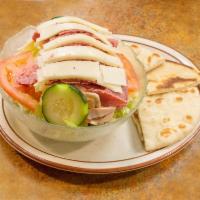 Julienne Salad · Ham, turkey, tomato, cucumber, hard boiled egg with Swiss and American cheese on tossed gree...