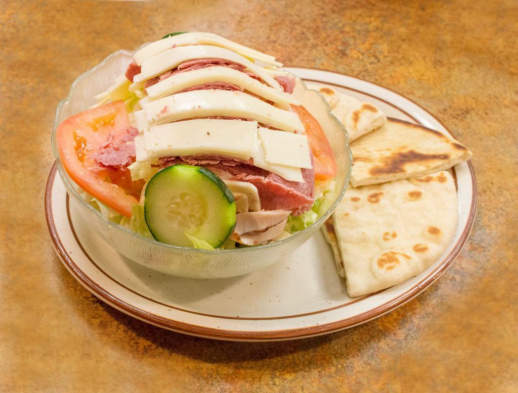 Julienne Salad · Ham, turkey, tomato, cucumber, hard boiled egg with Swiss and American cheese on tossed greens, served with a side of pita.