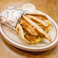 N.Y. Chicken Pita Sandwich · Deep fried chicken strips with mayo, lettuce, tomato, Swiss and American cheese.
