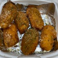 Stuffed Cream Cheese Jalapenos · A 6 count of large jalapenos stuffed with cream cheese and breaded. Fried crispy and served ...