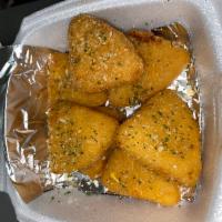 Mac and Cheese Wedges · Macaroni and cheese breaded and shaped into little trianlge bites. Fried to cheesy perfectio...