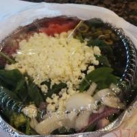 Spinach Salad · Spinach, romaine, onion, olives, bacon, cheese, feta and tomato.