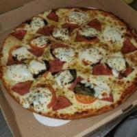 Margherita Pizza · Olive oil or pizza sauce, basil, fresh mozzarella, and roma tomatoes.