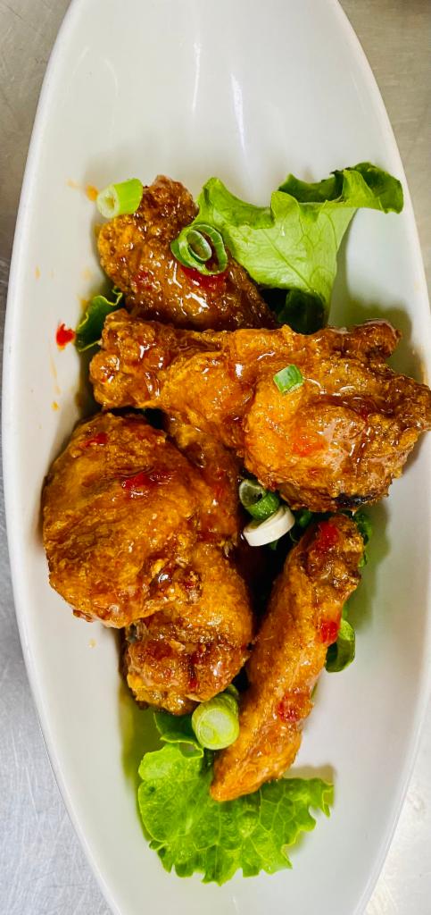 Mountain Chicken Wings · 5 pieces. Chicken wings with spicy tamarind sauce.