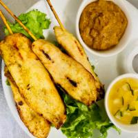Satay Chicken · 4 pieces. Chicken on skewers,  with peanut sauce.