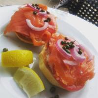 Smoked Salmon Bagel · Cream Cheese, Tomatoes, Red Onions, Capers & Lemon Wedges on a Bagel