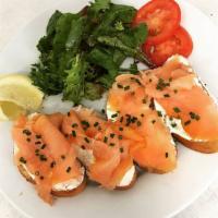 Smoked Salmon Small Plate · Creme fraiche, chives, fresh lemon on whole wheat crostini. Served with a mixed green salad.