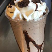 Mudslide Brownie · Chocolate lover's dream! Chocolate ice cream with brownies & chocolate sauce topped with whi...