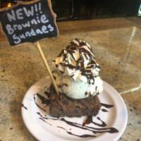 Brownie Sundae · House made brownie topped with a scoop Of your choice of ice cream. Topped with whipped crea...