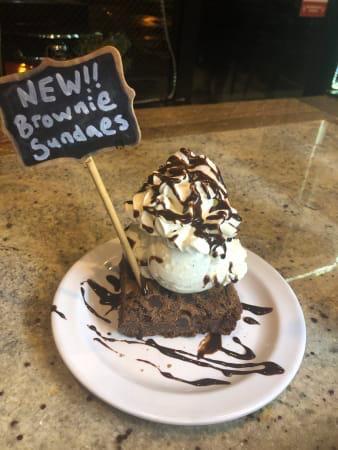 Brownie Sundae · House made brownie topped with a scoop Of your choice of ice cream. Topped with whipped cream and chocolate sauce

