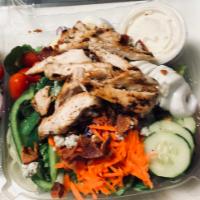 Cobb Salad · Garden salad topped with marinated grilled chicken breast, crumbled blue cheese, bacon bits,...