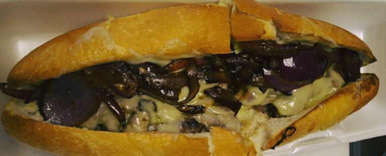 French Dip Roast Beef Sandwich · Thinly sliced roast beef, cooked in house-made gravy, served on a toasted roll, with balsamic fried onions and Swiss cheese. Served with au jus sauce.