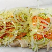 Turkey and Cheese Hoagie · Made with lettuce, tomatoes, onions, salt, pepper, oregano and oil.