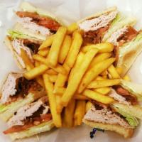Turkey & Cheese Club Sandwich · With lettuce, tomatoes, bacon and mayo. On your choice of white, wheat, or rye toast with ch...