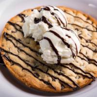 Deep Dish Cookie · A chocolate chip cookie made in a deep dish pan served with vanilla ice cream.