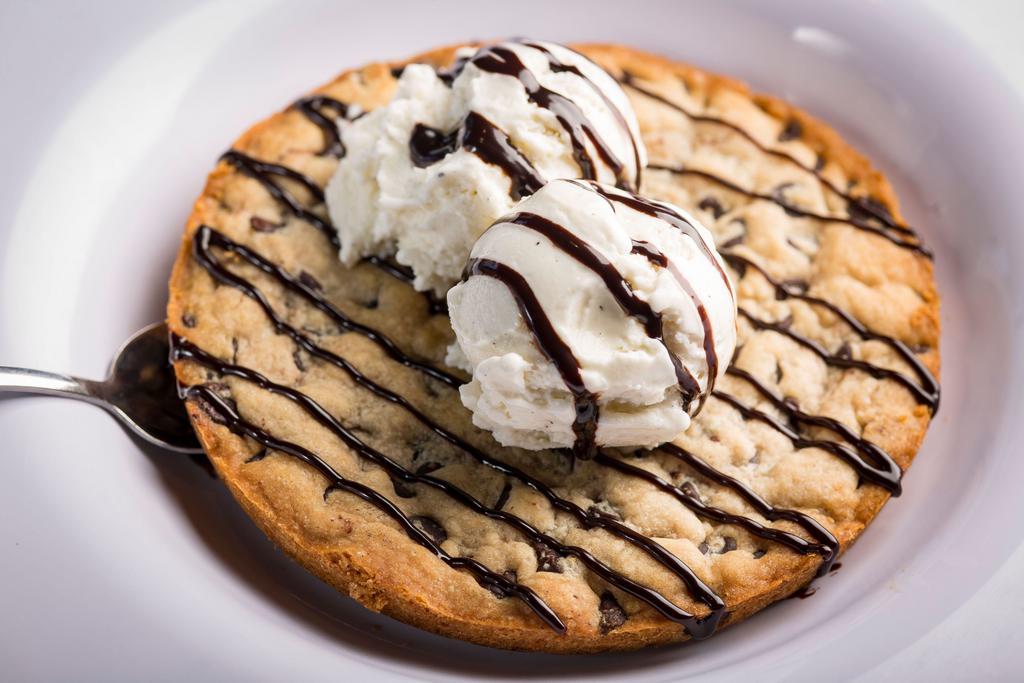 Deep Dish Cookie · A chocolate chip cookie made in a deep dish pan served with vanilla ice cream.