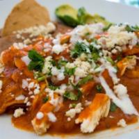 Chilaquiles con Huevo · Fried corn tortillas mixed with eggs and choice of red or green sauce topped cheese and sour...