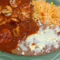 Camarones a la Diabla  · Shrimp sautéed in a spicy red sauce dish is served with rice and beans and homemade tortilla...