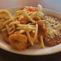 Camarones Empanizados · Delicious breaded shrimps served with a side of french fries, rice, beans a homemade tortill...