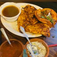 Tacos Estilo Diablito serving of 2 tacos  · Tacos Diablitos are dipped in a red tomato sauce and slightly fried melted cheese between to...