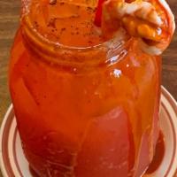 Regular Michelada · A michelada with your choice of beer, limon, valentina, clamato