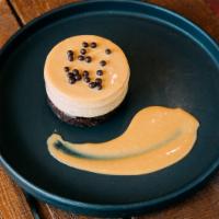 Chai Choco-Flan · Infused Chai lechera flan stacked on a chocolate brownie,
dulce de leche and vaniLla chai wh...