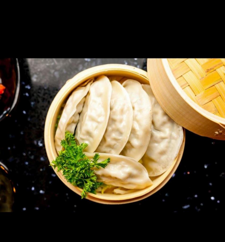Jjin Mandu · Steamed seasoned ground pork and vegetable dumplings.