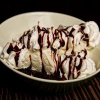 Ghirardelli Brownie Sundae  · Warm Ghirardelli brownie topped with vanilla bean ice cream, hot fudge, whipped cream and a ...