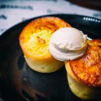 Cornbread with Maple Butter · Two Homemade Cornbread Muffins with a Sweet Maple Butter Topping.