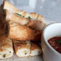 Bread Stix · Twisted dough, with our special blend of herbs and spices, baked and served with a side of m...