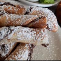 Nutella Stix · Nutella, all twisted up in dough, baked, and dusted with powdered sugar.