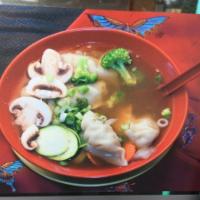 Wonton Soup · Homemade Chinese dumplings with minced pork and shrimp filling in soup.