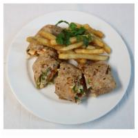 Tandoori Chicken Roll · 2 rolls. Grilled tandoori chicken marinated overnight with exotic spices rolled inside 2 pie...