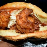 Tandoori Chicken Burger · Grilled to perfection chicken strips marinated overnight in exotic seasoning, topped with le...