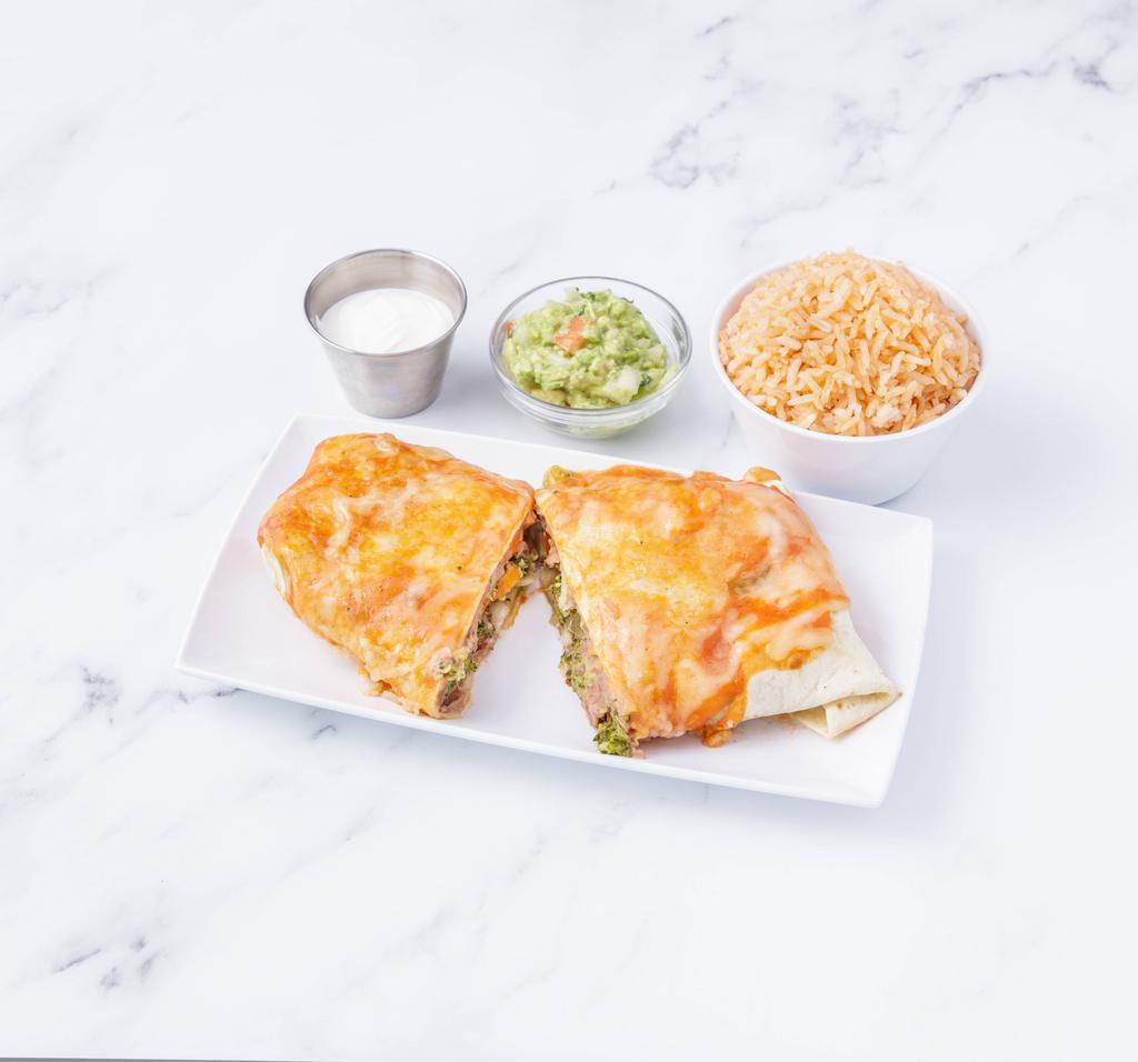 Burrito de Campo · Big flour tortilla rolled, stuffed with refried beans, and vegetable topped with ranchera sauce melted cheese, rice, sour cream, and guacamole.