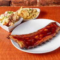 Full Rack of Ribs · slow braised in cilantro lime sauce, finished with sweet and tangy BBQ saauce, fries & chef ...