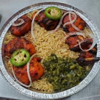 Jujeh Kabab · Flame grilled boned chicken pieces served with salad, bread, rice, spinach, white sauce and ...