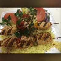 Chicken Kabob Platter · Marinated grilled chicken with grilled vegetables on a bed of rice.