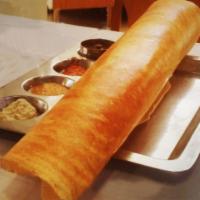 Plain Dosa · Thin rice and lentil crepe. Served with three varieties of chutneys and sambar.