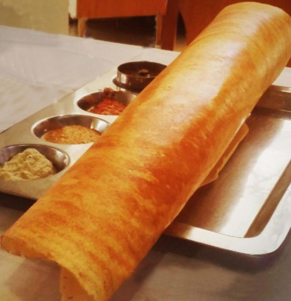 Plain Dosa · Thin rice and lentil crepe. Served with three varieties of chutneys and sambar.