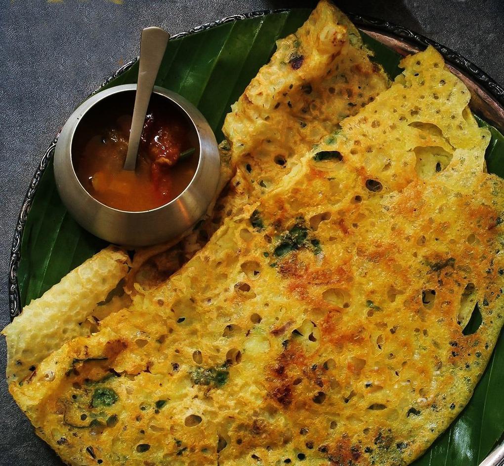 Rava Dosa · Thin crispy wheat and rice crepe mildly spiced. Served with 3 varieties of chutneys and sambar.