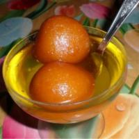 Gulab Jamun · 2 nos. balls made from khoa, deep-fried, and served with sugar syrup.