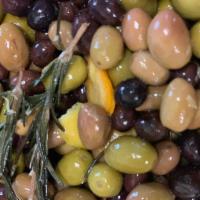 House Marinated Olives · Mixed Spanish olives bathed in olive oil with lemon and orange and fresh rosemary. Vegetaria...