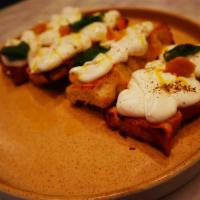 Whipped Ricotta Crostini · Charred bread, whipped ricotta and confit garlic 
